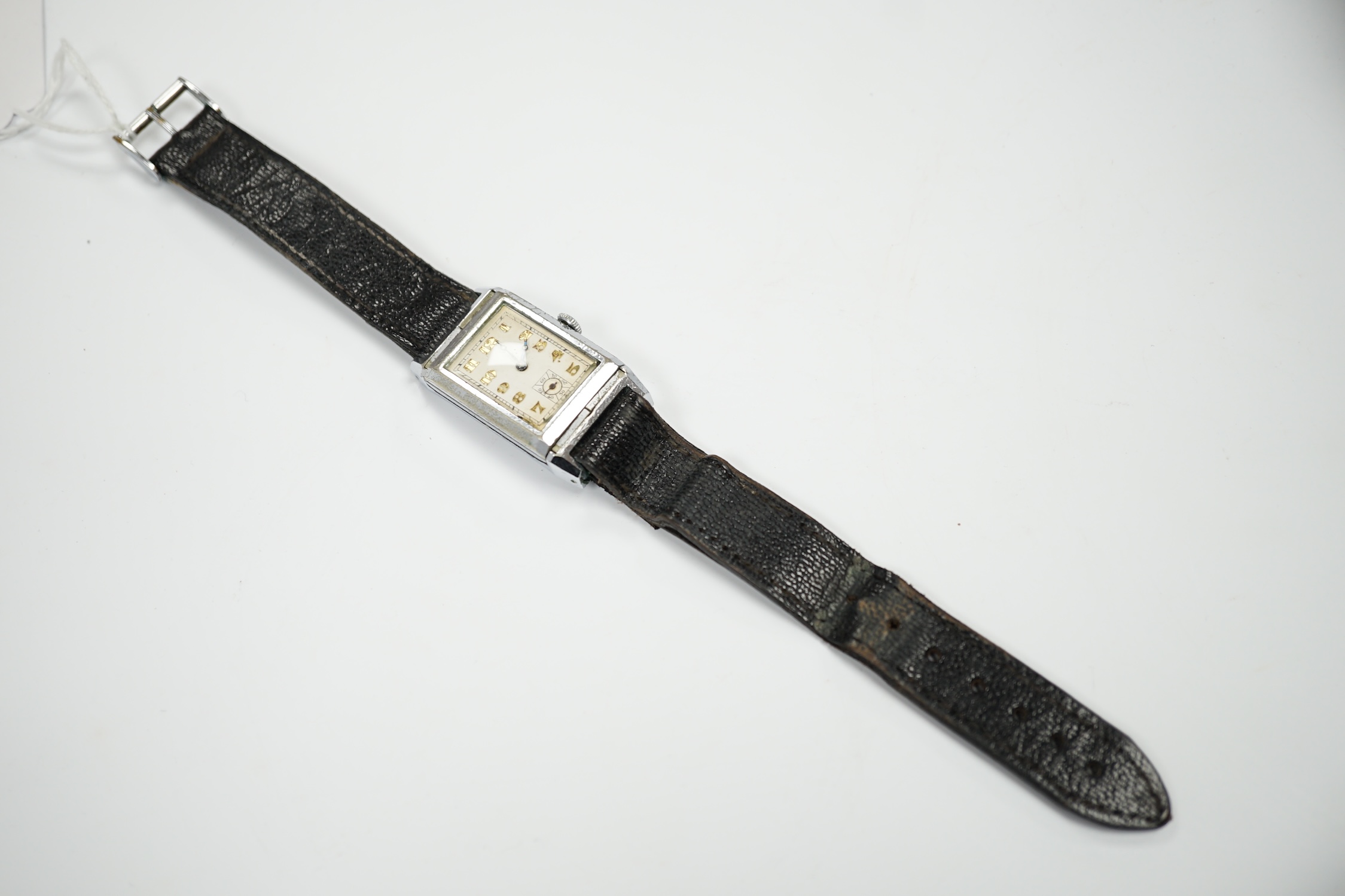 A gentleman's mid 20th century steel 'reverso' manual wind rectangular dial wrist watch, with Arabic dial and subsidiary seconds, the back with engraved initials and enamel.